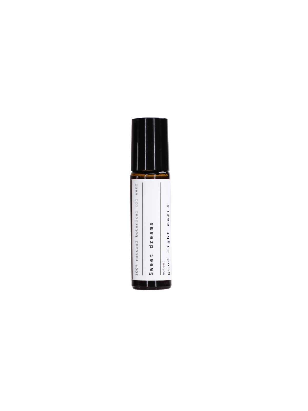 Sweet Dreams Aroma Roll-On in einer braunen Glasflasche mit schwarzem Verschluss vor schwarzem Hintergrund, Aromatherapie.