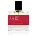 Bon Parfumeur 302: Amber glass bottle with black cap and red label on white background, fragrance.
