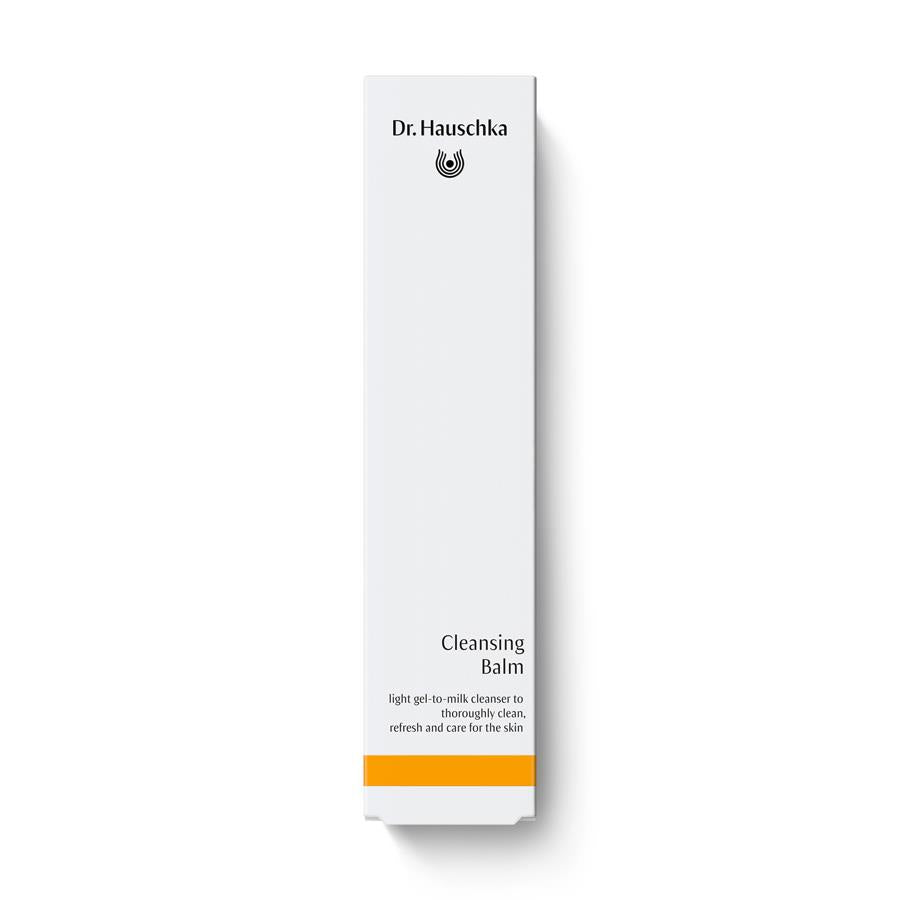 Dr. Hauschka Cleansing Balm – white cardboard packaging with orange stripe, white background – skin cleansing