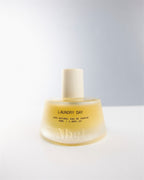 Abel Laundry Day Parfüm – gelbe Glasflasche 50ml, cremefarbener Verschluss, weißer Hintergrund – Parfüm