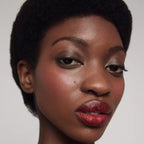 Cream Blush Happy – Model with rosy cheek, natural glow, white background – face makeup