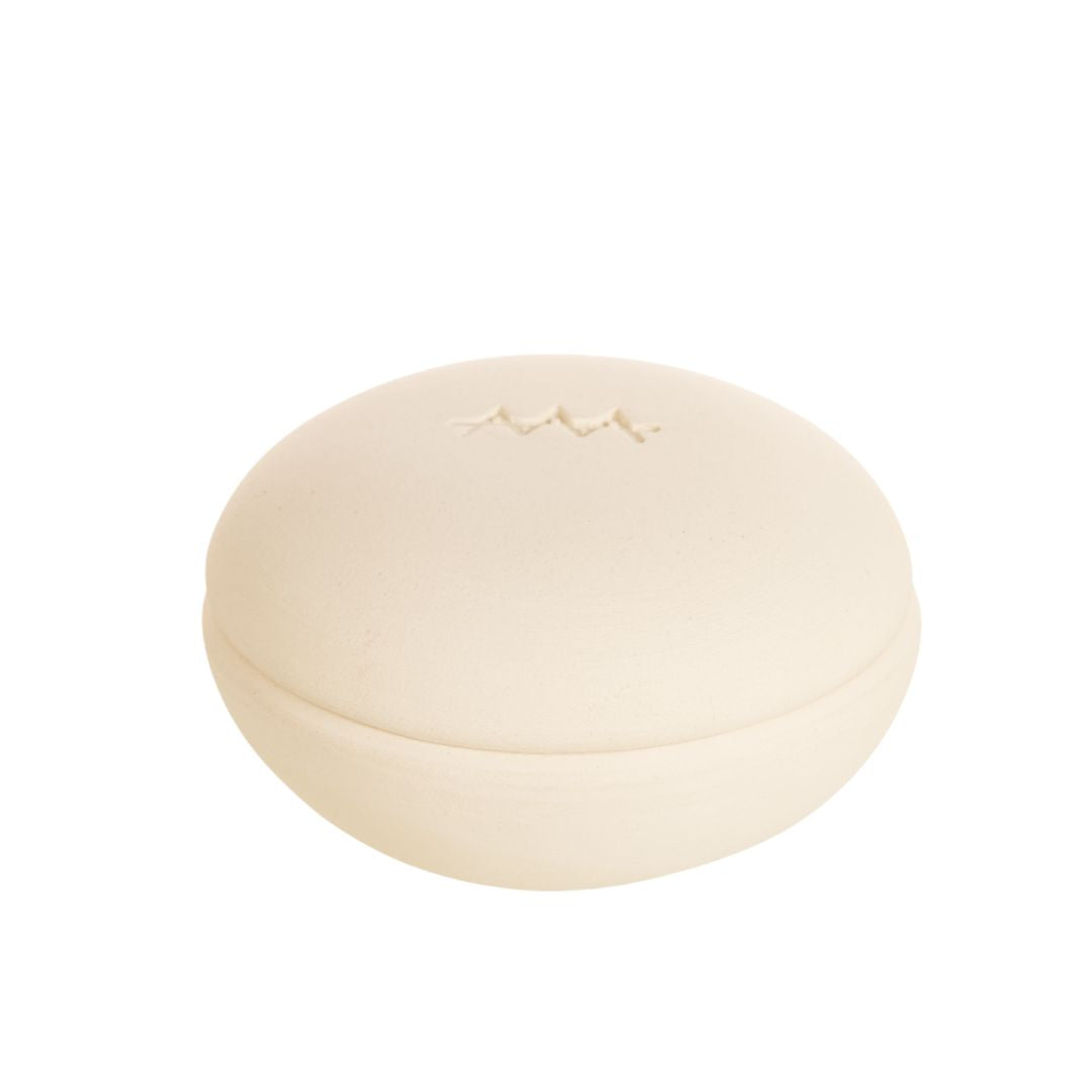Scia round container – cream-colored, matte, with engraved logo, white background – skin care