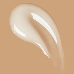 Air Dry Styling Cream Travel – cremige Textur auf beige Hintergrund – Haarpflege