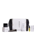 Le Prunier Signature Mini Set – weiße Verpackung mit schwarzer Tasche, verschiedene Mini-Produkte, weißer Hintergrund – Hautpflege