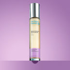 The Organic Pharmacy Brightening Plus Serum in a bottle with silver cap on a purple background, skin care mood