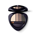 Open eyeshadow palette with three neutral shades and an applicator in a dark blue case.