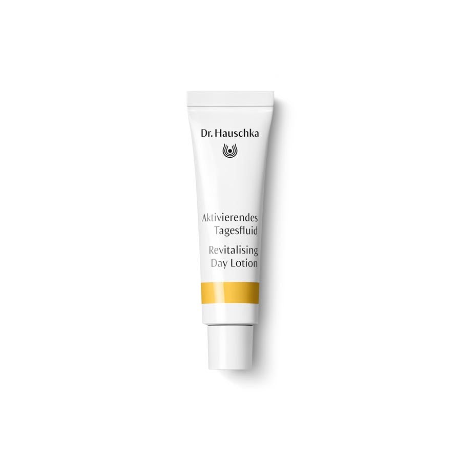 Dr. Hauschka Revitalising Day Lotion – white tube with gold-yellow stripe, white cap, white background – skin care