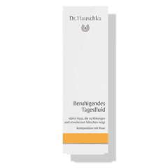 Dr. Hauschka Soothing Day Fluid – white cardboard packaging with orange stripe, white background – skin care