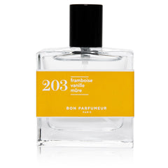 Bon Parfumeur 203: Raspberry glass bottle with yellow label and black cap on white background, fragrance