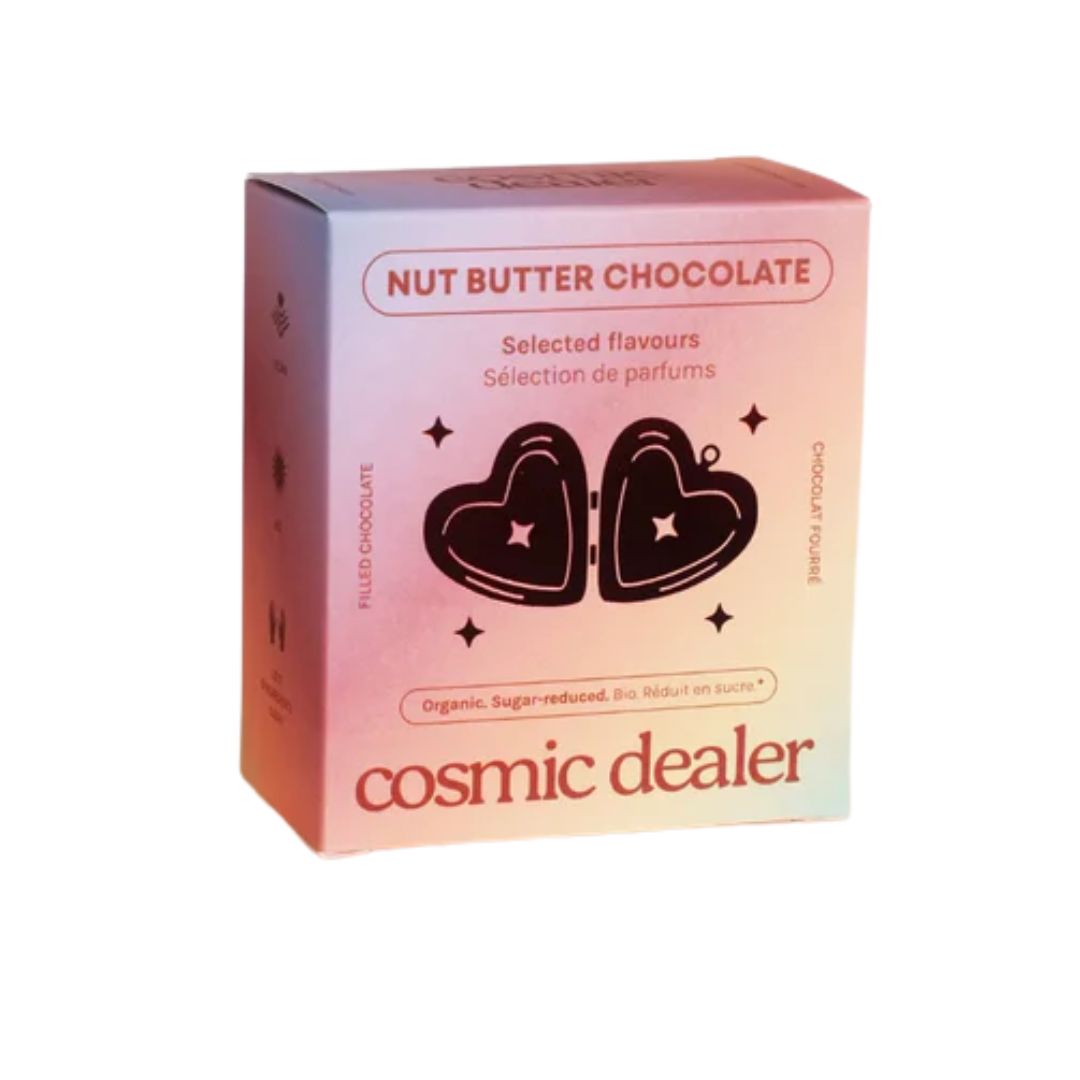 Cosmic Dealer Nut Butter Chocolate – rosa-orangefarbene Schachtel, Herz-Motiv, weißer Hintergrund – Süßigkeiten