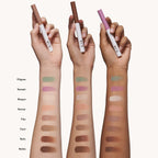 ILIA Eye Stylus Shimmer – white tube with colored cap, swatches on three skin tones, cream background – eye makeup
