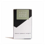 Aktivkohleseife – black and white cardboard packaging with olive green label, white background – skin care