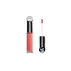 Beauty Lip Gloss Fascination in a glass tube with a silver cap on a white background, lip care.
