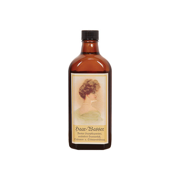 Coffein Hair Water – brown glass bottle with black screw cap, white background – hair care