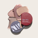 Kjaer Weis Cream Eye Shadow Refill – round red refill with grey lid, creamy swatches on beige background – eye makeup