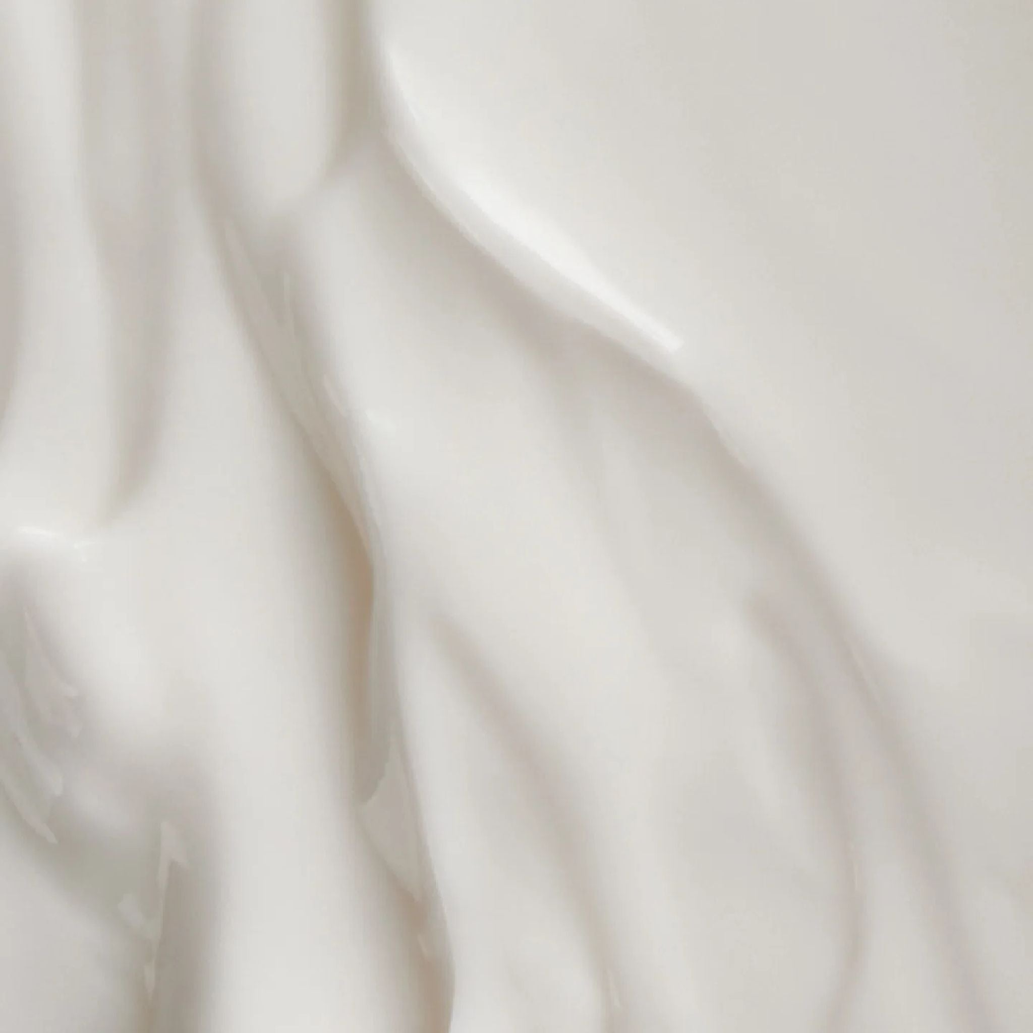 Nahaufnahme der weißen Textur der Körpermilch für die Hautpflege