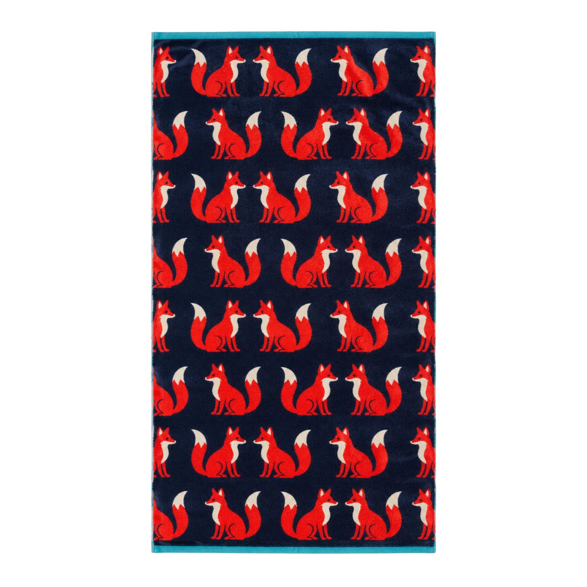 Kissing Foxes Organic Cotton Bath Towel in dark blue with red foxes on a white background, bathroom accessory