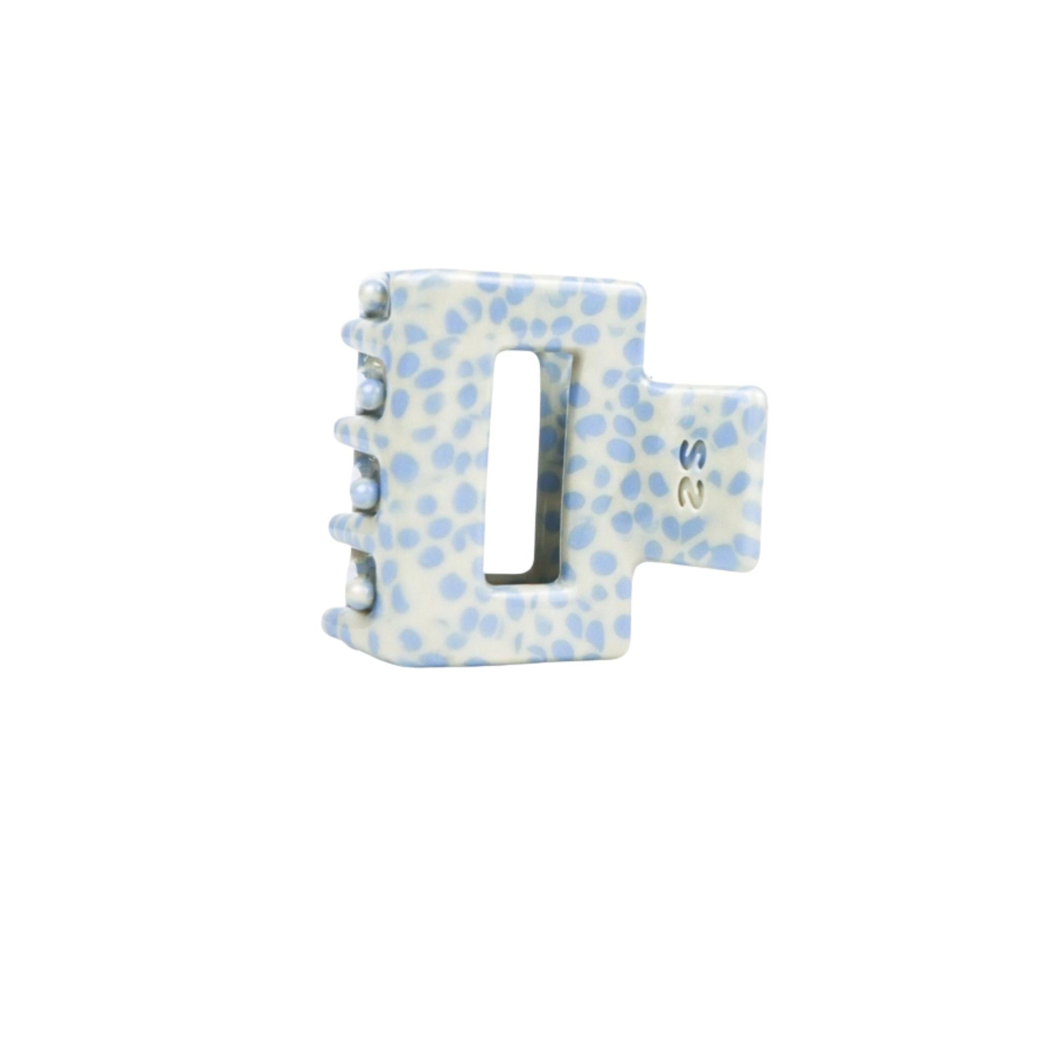 small blue and white hair clip