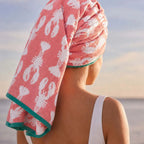 Lobster Pink Organic Cotton Bath Towel in coral with lobster print worn as a hair wrap, bath accessories