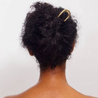 French gold hairpin in womans hair