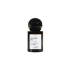 Very Bad Rice Extrait de Parfum in a dark brown glass spray bottle with a round cap on a white background, 30ml fragrance